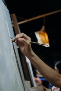 A focused artist painting quietly under warm light, symbolizing true passion and inner creativity.